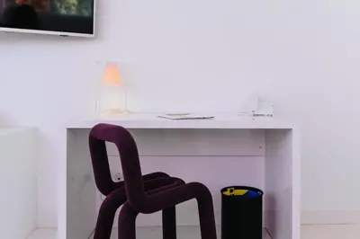 a chair sits in front of a desk at Le Meez in Carcassonne