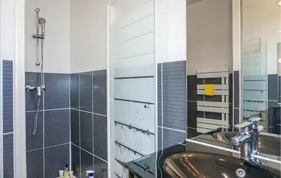 a bathroom with a sink and a shower at Lovely Home In Cruzy With Kitchen in Cruzy