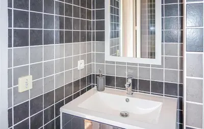 a bathroom with a white sink and a mirror at Lovely Home In Cruzy With Kitchen in Cruzy