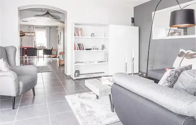 a living room with a couch and two chairs at Lovely Home In Cruzy With Kitchen in Cruzy