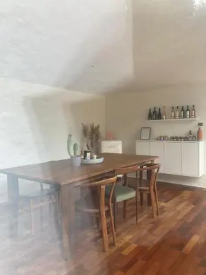a view of a table and chairs from a window at NOUS in Agel