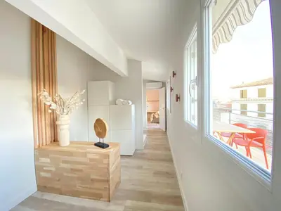 a hallway of a house with a large window at La Terrasse sur les Toits in Narbonne