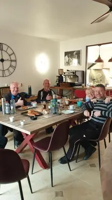 a group of people sitting at a table at MAURY CAT'STUDIO 66 in Maury