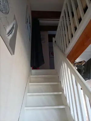 a staircase leading up to the basement of a house at L'Appart de Karine et Nico in Gruissan