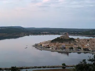 a small island in the middle of a body of water at L'Appart de Karine et Nico in Gruissan