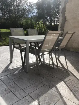 a table and two chairs sitting next to each other at Gîte la Lezardière accès privé canal du midi ** in Castelnaudary