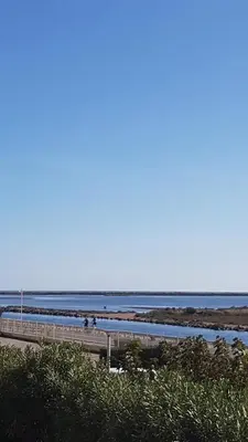 a beach with the ocean in the background at studio gruissan proche plage des chalets in Gruissan