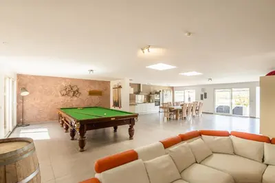 a living room with a pool table in it at Villa avec piscine et Jaccuzy in Bize-Minervois