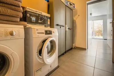 a laundry room with a washer and dryer at Villa avec piscine et Jaccuzy in Bize-Minervois