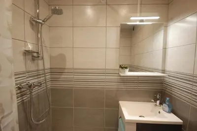 a bathroom with a shower and a sink at Saphir de Gruissan in Gruissan