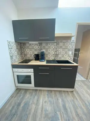 a kitchen with a sink and a stove at Douceur occitane in Saint-Chinian