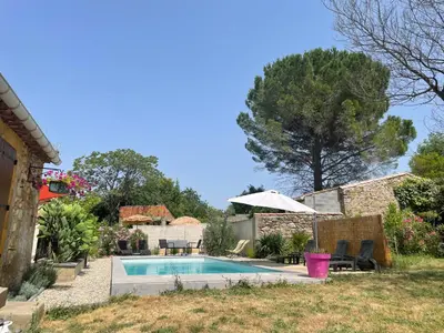 a swimming pool in the backyard of a house at Douceur occitane in Saint-Chinian