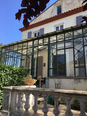 a large glass building with a fence in front of it at LaFabriek in Canet d'Aude