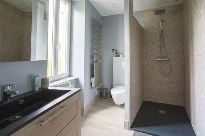 a bathroom with a sink and a toilet and a shower at LaFabriek in Canet d'Aude