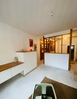 a living room with a couch and a table at Le trois nourrices in Narbonne