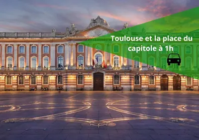 a large building with a green sign in front of it at Le Cathare-Limoux-WIFI-Parking free-Oc-Keys in Limoux