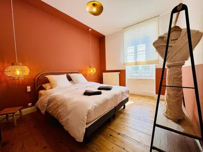 a bedroom with a bed with a ladder in it at L'Oustal de Papet in Ferrals-lès-Corbières