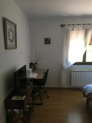 an office with a desk and a computer in a room at Coeur de nature in Rasiguères