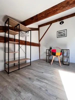 a room with two bunk beds and a chair at Beau T4 au cœur du centre ville in Narbonne