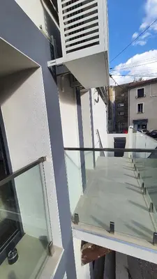 a balcony of a building with a window at Beau T4 au cœur du centre ville in Narbonne