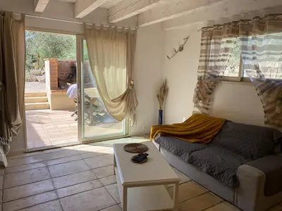 a living room with a couch and a table at Les Plages Haute in Peyriac-de-Mer