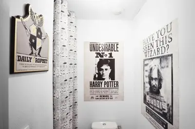 a bathroom with three movie posters on the wall at HARRY POTTER - Escape Game - Expérience Magique in Carcassonne