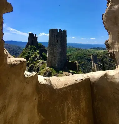 a view from the ruins of a castle at 3 Star 3 bed Air Conditioned QUERTINEUX 100m to Historic 4 Cathar Châteaux Lastours access to a very Pretty Riverside Garden!! in Lastours