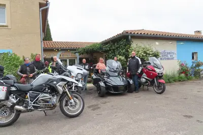 a group of motorcycles parked in front of a house at Bel Hotel Restaurant la Gentilhommière in Trèbes