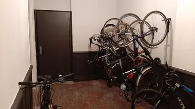 a bunch of bikes parked in a room at Le 9 de Cour, Chambre Caouette in Carcassonne