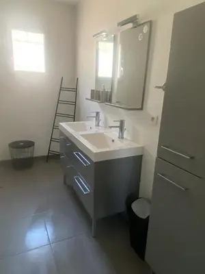 a bathroom with a sink and a mirror at Villa privative 3 chambres et piscine priv près Carcassonne in Carcassonne