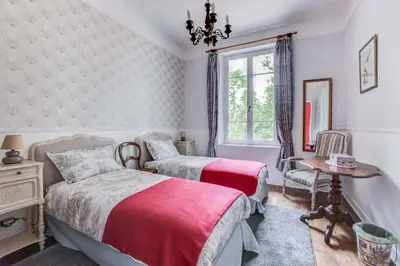 a bedroom with two beds and a window at Chateau de Pourpry in Damiatte