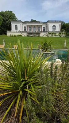 a large house with a pool in front of it at Chateau de Pourpry in Damiatte