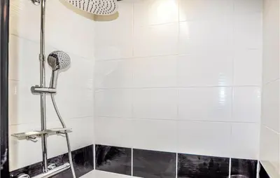a bathroom with a shower with a shower head at 1 Bedroom Stunning Home In Bélesta in Bélesta