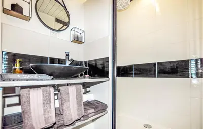 a bathroom with a sink and a shower at 1 Bedroom Stunning Home In Bélesta in Bélesta