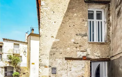 an old building with a window on the side of it at 1 Bedroom Stunning Home In Bélesta in Bélesta