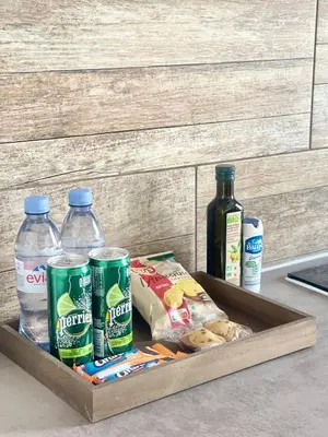 a tray of food and drinks and bottles of water at Chez-YU in Carcassonne