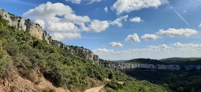 a view of a mountain with a blue sky and clouds at Le Chalet in Saint-Jean-de-Minervois