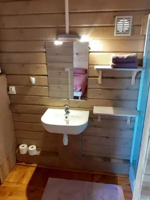 a bathroom with a sink and a mirror at Le Chalet in Saint-Jean-de-Minervois