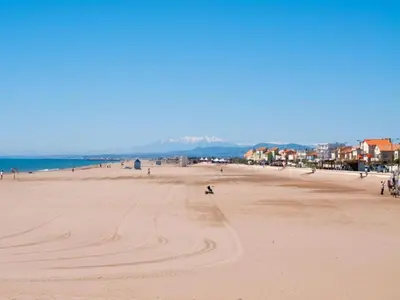 a group of people walking on a beach at Elegant Villa in Sainte Valière in Sainte-Vallière