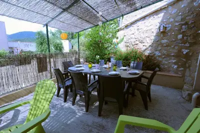 a table and chairs sitting on a patio at Cecile in Montgaillard