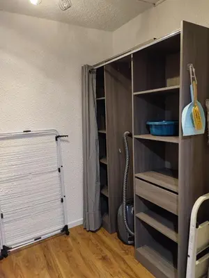 a closet with a white door and a shelf at Escale à Gruissan au coeur de la Marina in Gruissan