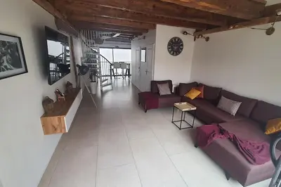 a living room with a couch and a table at Beau T3 au cœur du centre ville in Narbonne