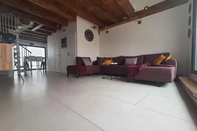 a living room with two couches and a table at Beau T3 au cœur du centre ville in Narbonne