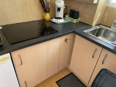 a kitchen with a sink and a counter top at Gruissan les MARINES II in Gruissan