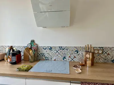 a kitchen with a counter top with a stove at Coural' Chic in Narbonne