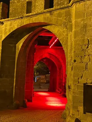 an archway with red lights in a building at La Rosela de la Cité in Palaja