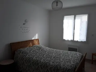 a bedroom with a bed and a window at Maison individuelle neuve avec piscine in Limoux