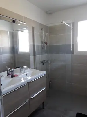 a bathroom with a sink and a shower at Maison individuelle neuve avec piscine in Limoux