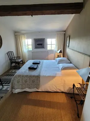 a bedroom with a large bed in a room at Maison familiale de charme in Chalabre