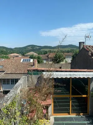 a view of a city with a building with a roof at Appartement mirepoix in Mirepoix